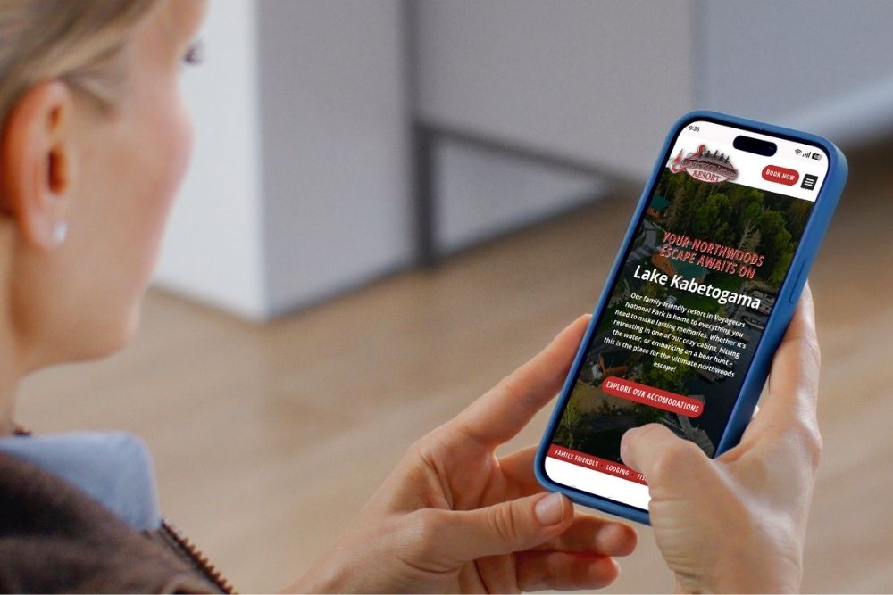 A close up photo of a mobile phone showing a well-designed mobile responsive website interface for local businesses.