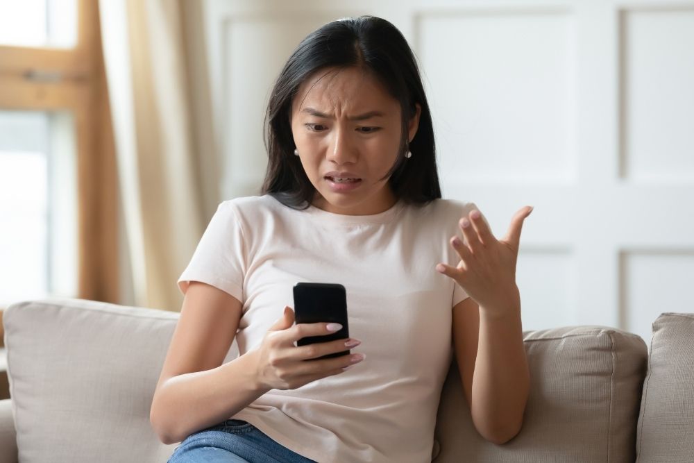 Local business owner frustrated with poor mobile website design affecting customer experience.