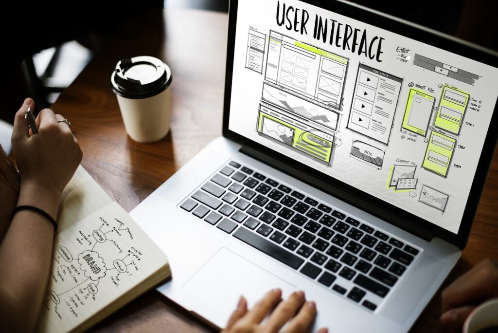 Laptop displaying a user interface design plan showing scalable website performance.