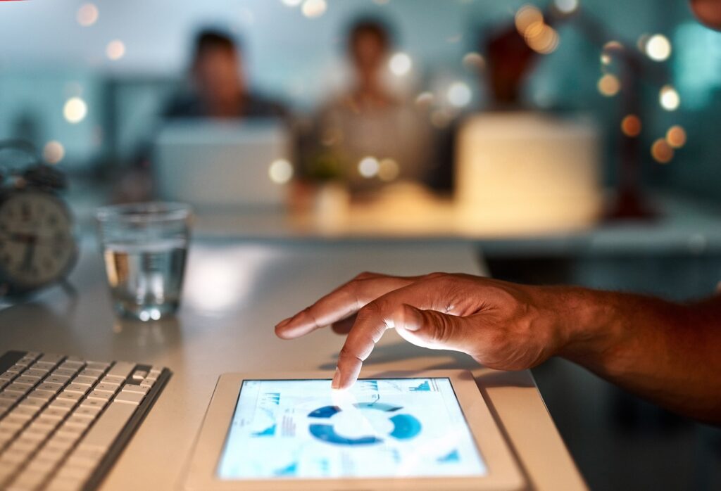 Man using a tablet to manage website data and maintain control over digital assets.