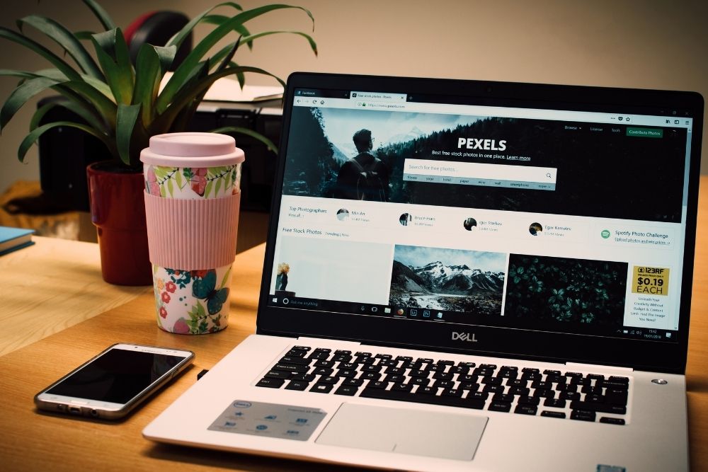 a laptop screen showing a royalty-free stock photo website