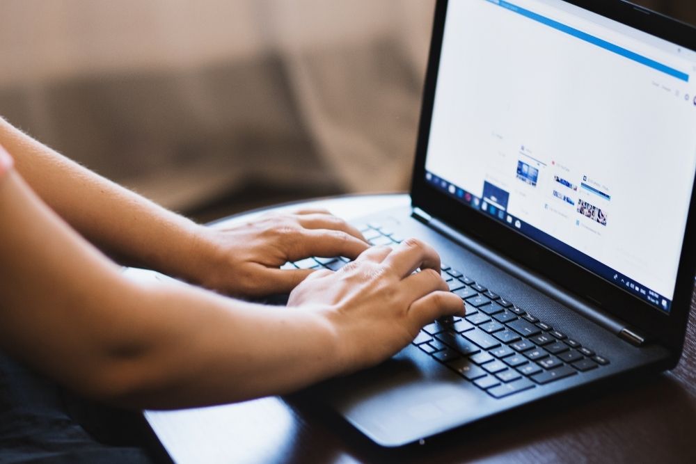a laptop screen showing a social media platform