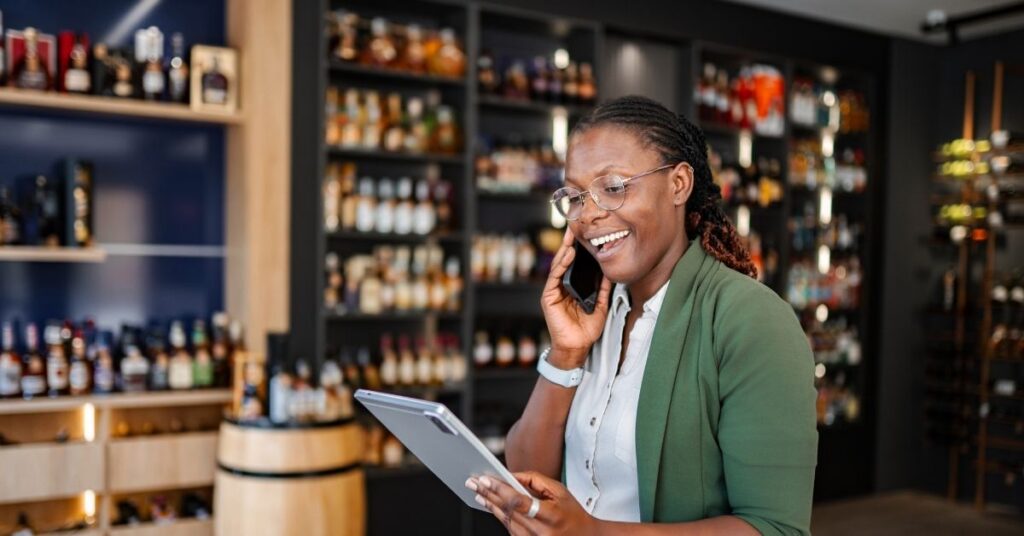 Business owner answering a client call quickly to optimize lead response time and win the job.