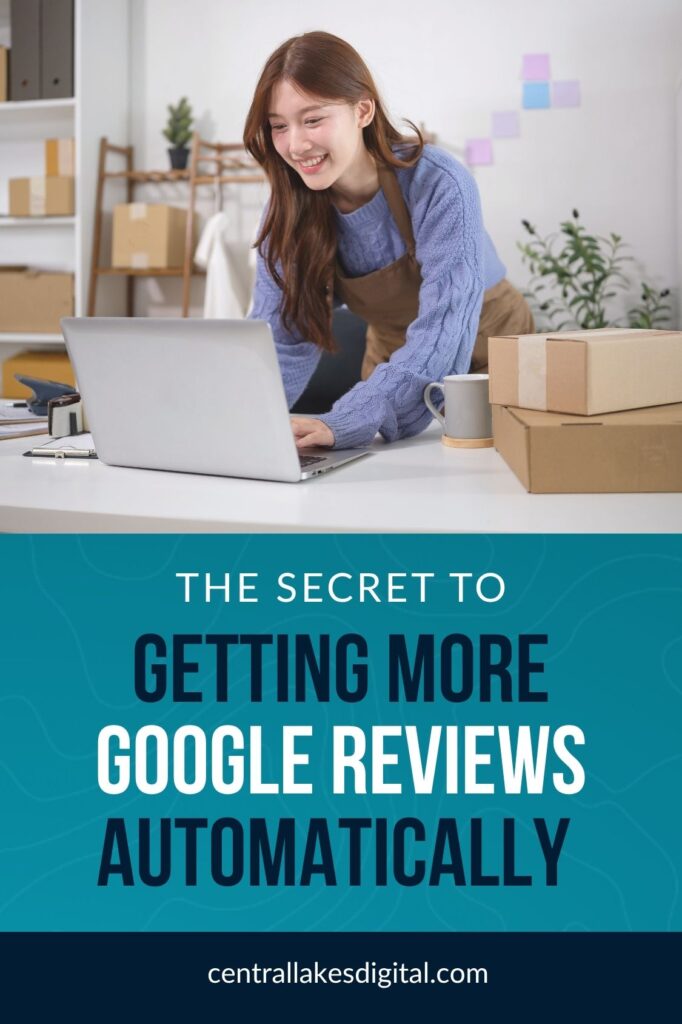 A smiling business owner using a laptop in a workspace with shipping boxes, featuring the text overlay: "The Secret to Getting More Google Reviews Automatically"